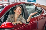 A female got a new vehicle key by applying Low Interest Car Loans in Canada