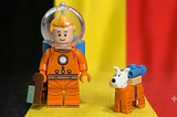Tintin and Milou in front of the Belgian flag.