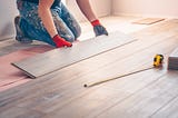 homeowner Installing new hardwood floors in their home