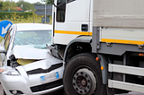 WHAT SHOULD I DO IF A COMPANY TRUCK DRIVER HIT MY CAR?