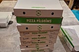 stack of pizza boxes