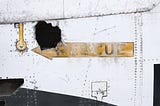 Sign with an arrow image reading “Rescue”