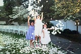 My cousin and I at a wedding as children