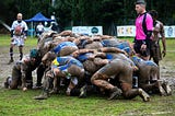 A muddy rugby scrum