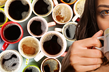 a woman drinks from a coffee mug with several cups of coffee on the background