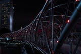 The “Helix Bridge” in Singapore at night with red illumination