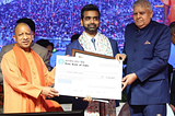 ClimateAi CEO Himanshu Gupta receiving the UP Gaurav Samman award from Chief Minister Yogi Adityanath and the Vice President of India, Jagdeep Dhankhar.