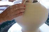 How is a handmade ceramic cremation urn made?