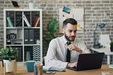 A guy working in the office.