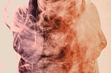 AN abstract art of warm coloured smoke in the form of crouched human