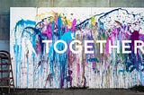 A painting of the word “together.” Whole Communities–Whole Health is a grand challenge at The University of Texas at Austin.