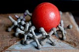 Jacks — red ball and tacks (childhood toy in 1970's)