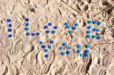 Words written and left / blue candles waiting in sand / to burn for lovers.