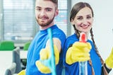 Two commercial cleaners with their cleaning equpiment