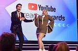 An image of Brittany Broski (“Kombucha girl”) and Brandon Rogers (comedian) at the YouTube Streamy Awards.