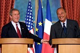 A friendly image on a podium with President Bush and President Chirac