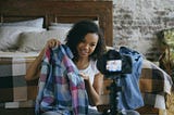 A Girl Showing Clothes on the Camera