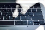 You can’t see TouchBar on MacBook Pro while the sun is shining.
