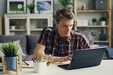A guy working with his laptop.
