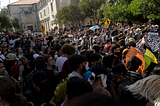 Image of students protesting at The University of Texas at Austin by the Texas Tribune, source: https://www.texastribune.org/2024/04/30/ut-austin-protest-arrests/