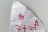 A piece of paper of my daughter showing of her math skills and giving herself an A+