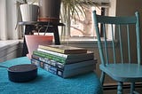 Photo of Amazon Echo Dot 2, on coffee table with books
