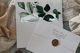 Elegant Simplicity: Emerald Greenery on Gray Wedding Invitation Envelopes