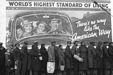 “Margaret Bourke-White’s 1937 picture of African American men, women and children huddled in line before a billboard — on which a car bearing a beaming white family (and their dog!) appears to drive confidently into the future beneath the ultimately ironic slogan, ‘World’s Highest Standard of Living’” (Time Magazine). Although taken to illustrate the aftermath of a flood, it has come to represent the vast inequalities racism has permitted in America.