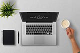 Man Using Laptop on Table Against White Background