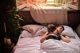 Woman lying in bed sleeping