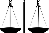 an analog balancing scale; used as an image of fairness