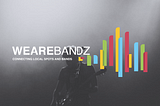Black and white picture of a guitarist on foamy stage as background with the WEAREBANDZ logo in the foreground.