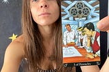 Rozalia Kieliszkiewicz holding the Three of Pentacles, Minor Arcana Tarot Card.