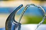 drinking fountain tap outdoors clear water jet spouting out