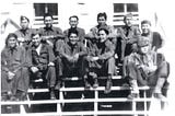 A group of Comanche soldiers in uniform sitting for a photo