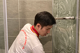Man cleaning the bathroom