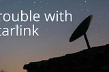 Starlink satellite dish, at night with starlit sky