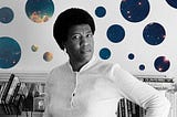 A portrait of Octavia Butler with celestial imagery in the background as representation of her science fiction connection.
