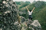 Woman climbing a mountain