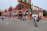 Outside a railway station in India. Three arches, heritage buildings, house food courts and executive lounges.