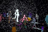 Digital avatars surround a white figure with floating white dots interspersed through a virtual world during the Immerse world hop of Venice VR Expanded 2021. This image is a screenshot from Joe Hunting’s video, Immerse x Venice.