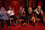 All the cast applauding manically