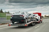 What Is The Difference Between Flatbed And Regular Towing?