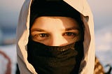 White man’s face covered with balaclava