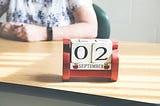 A school block desk calendar for September 2nd