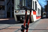 Trimet MAX with 2 Spin Electric Scooters in Portland, Oregon