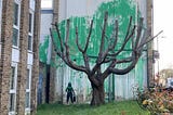 Banksy’s Urban Tree Artwork: A Green Stencil Sparks Debate in North London