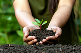 Woman planting in fresh soil-”Life Goes On — Keep up” by “Arthur G. Hernandez”
