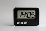 A small digital timer with time set to 14:05