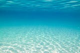 Crystal clear turquoise ocean water, taken from under the water.